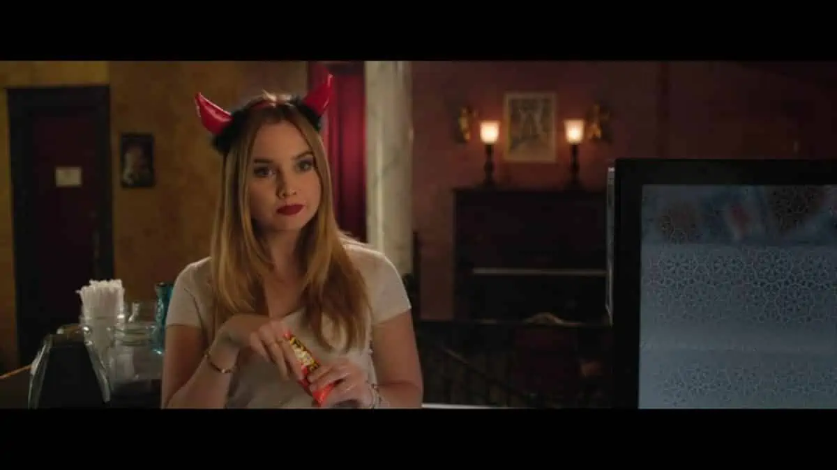 Liana Liberato as Clara with little devil horns on her head.