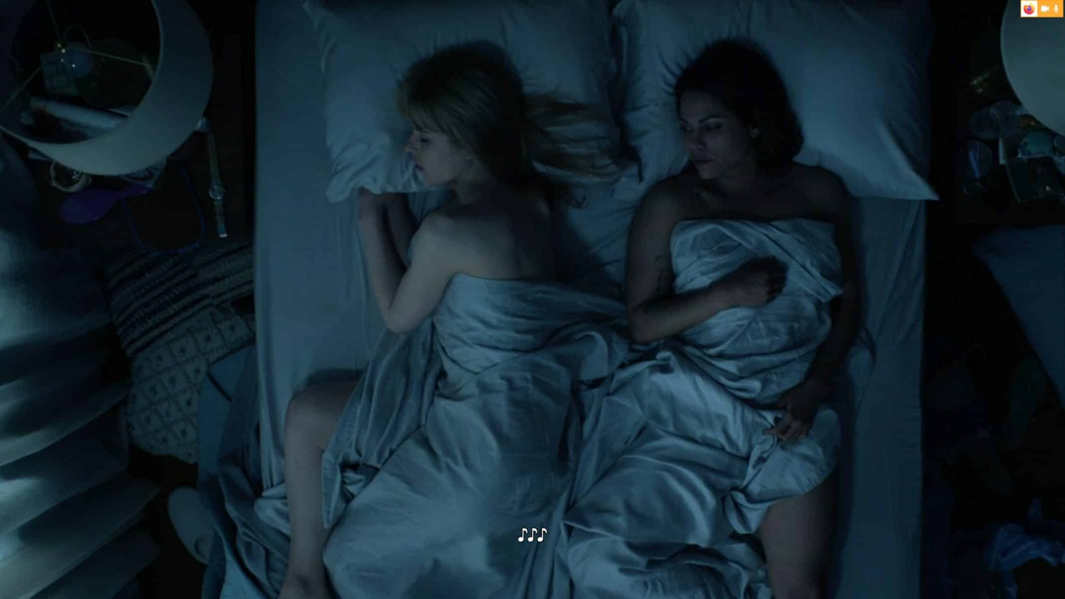 Devonne and Jackie in bed together.