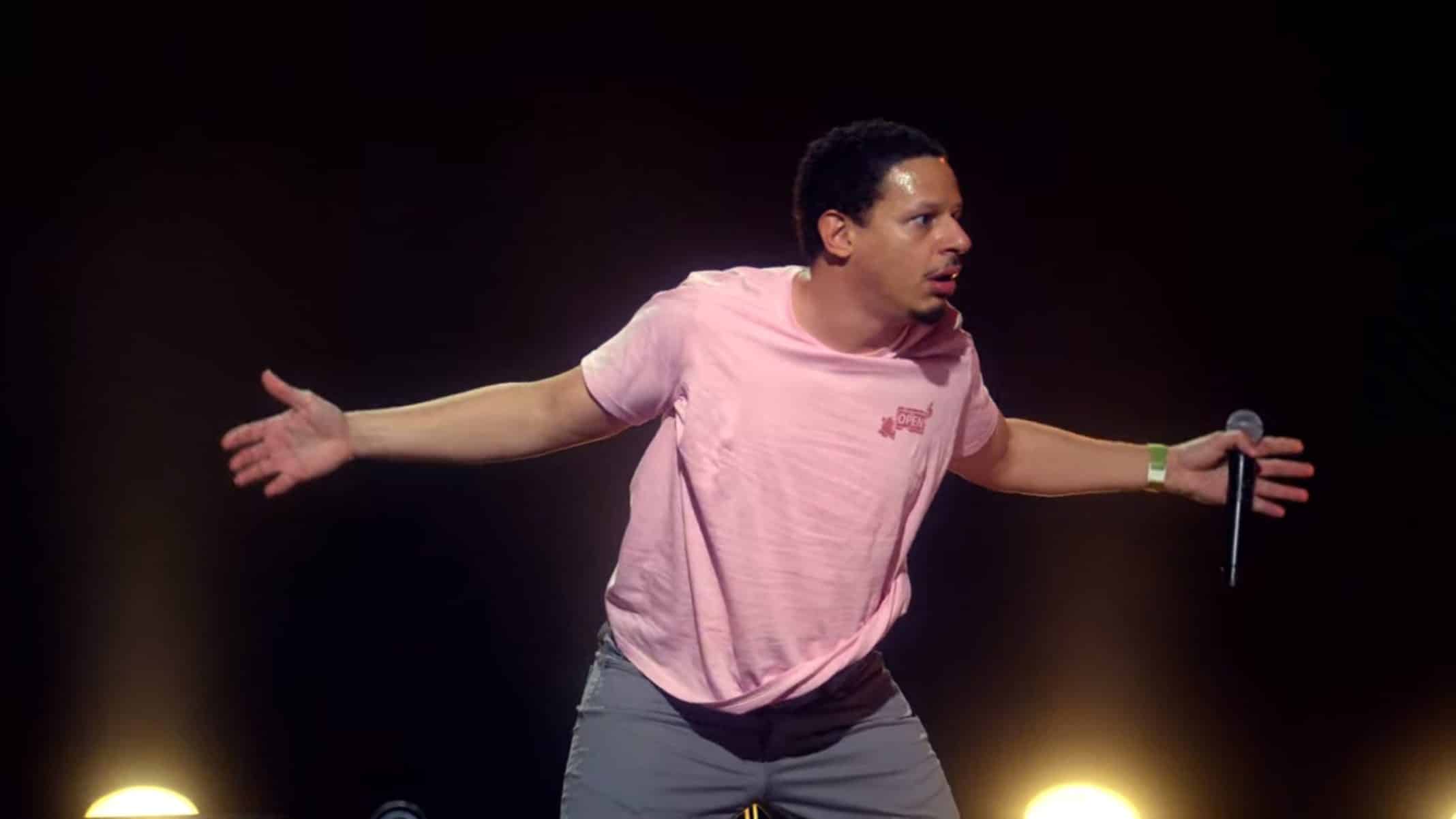 Eric Andre with arms stretched out.