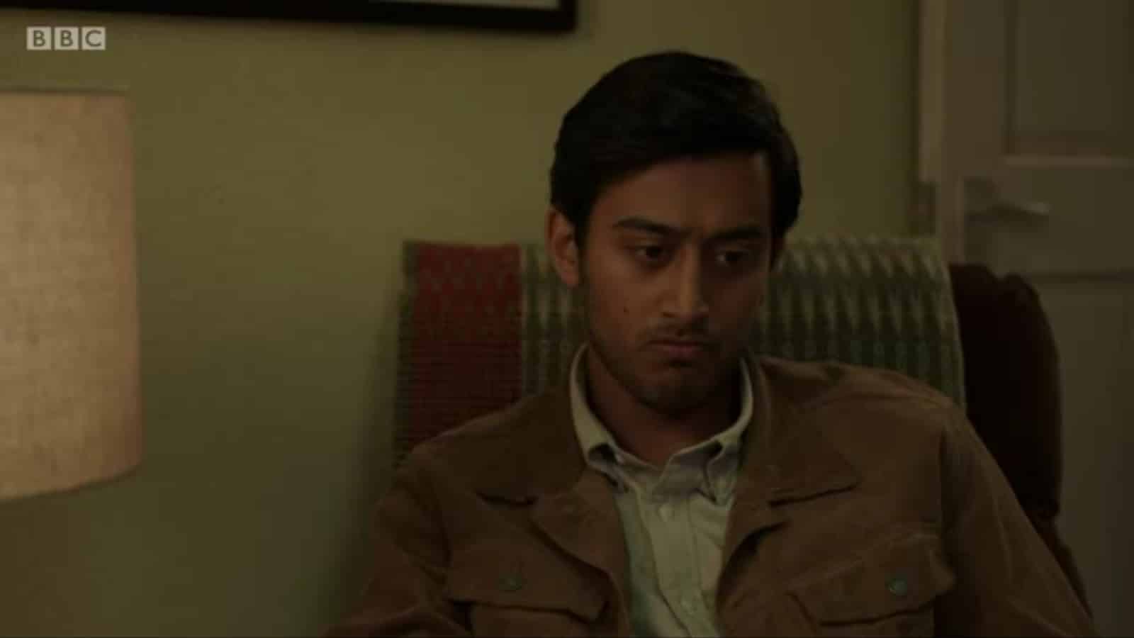 Zain (Karan Gill) sitting, and contemplating something.