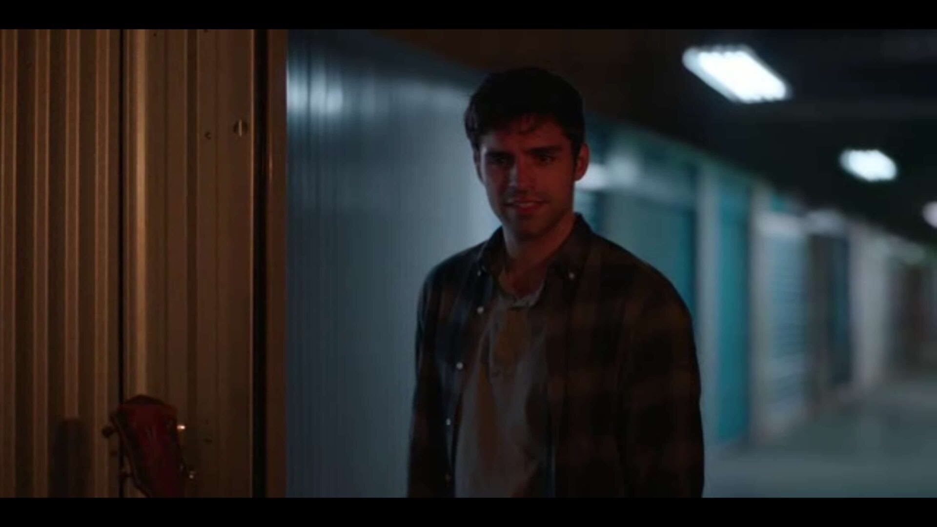 Ethan (Sean Teale) in Bess' storage unit.