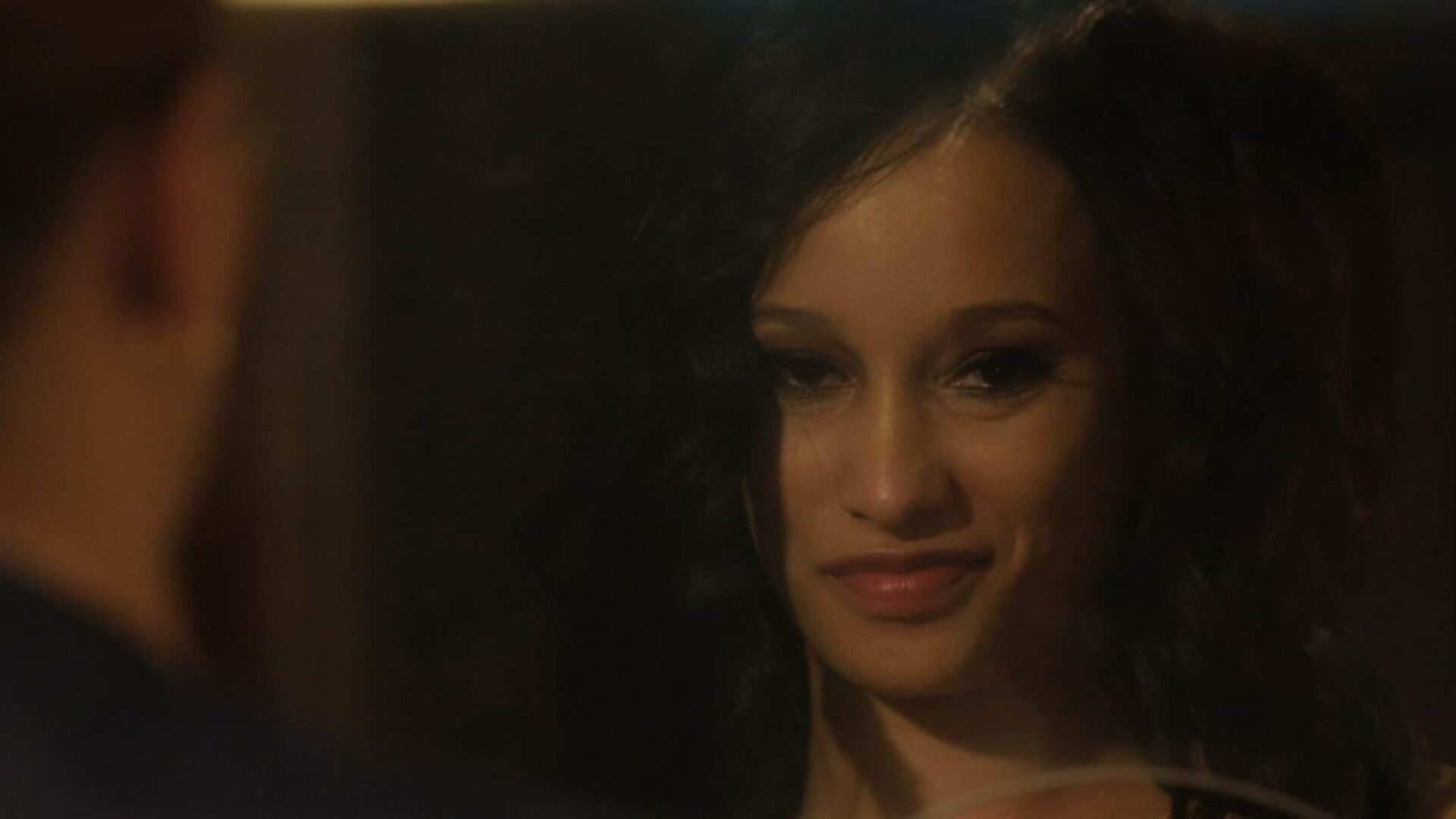 Hailey (Elarica Johnson) smiling towards the camera.