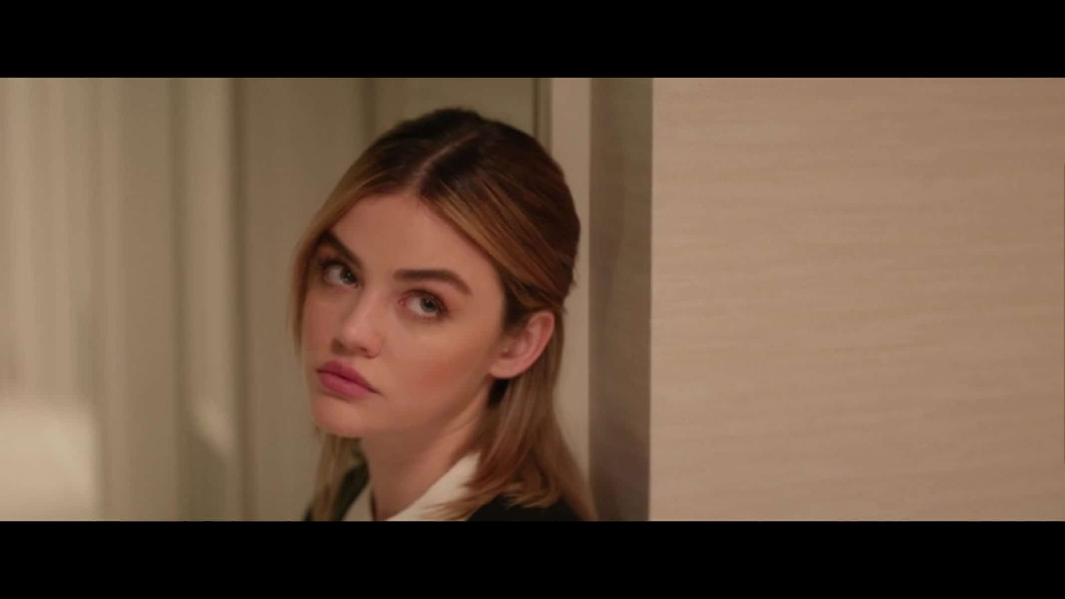 Lucy (Lucy Hale) looking at Grant.