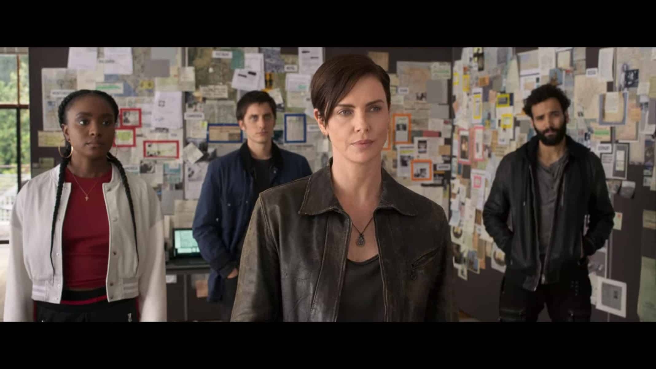 Nile (Kiki Layne), Nicky (Luca Marinelli), Andy (Charlize Theron) and Joe (Marwan Kenzari) standing together at the end of a movie.