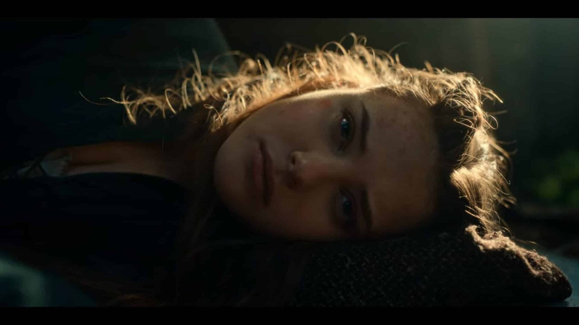 Nimue (Katherine Langford) waking up.