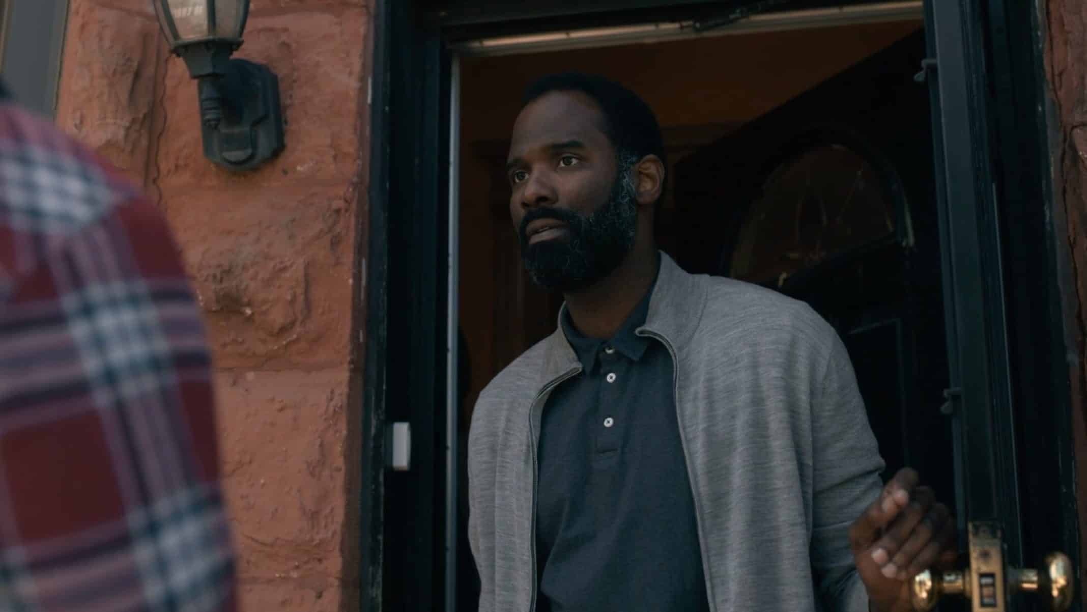 Omari (Cedric Mays) answering his door.