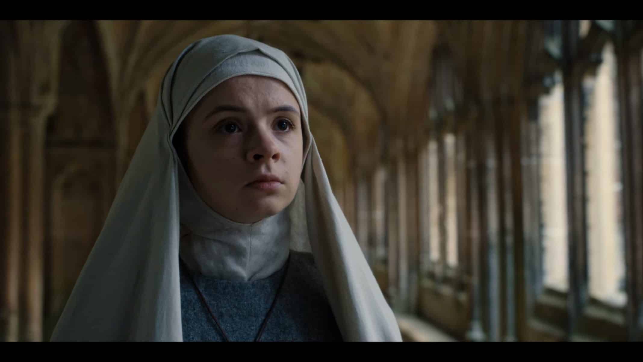 Sister Iris (Emily Coates) as she asks questions of Morgana.