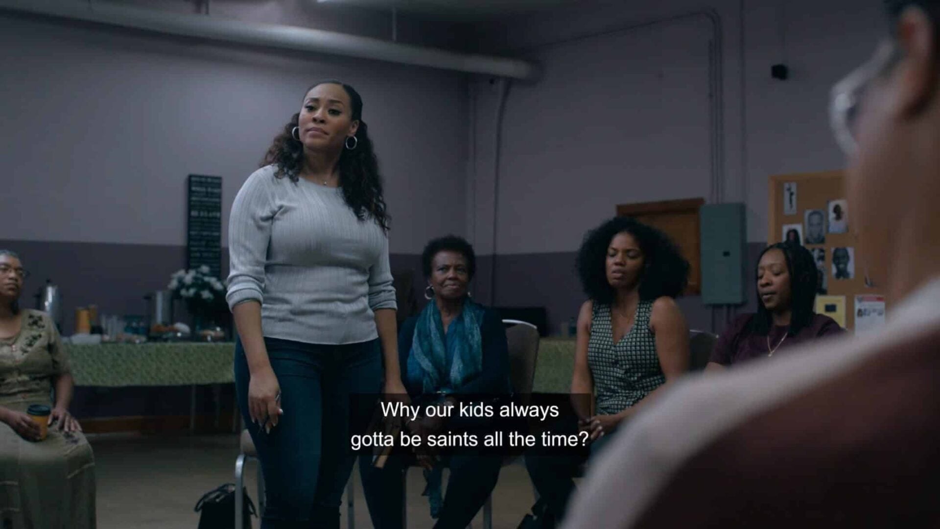 Tracy (Tai Davis) addressing her group who initially is uneasy about supporting Nina and Dre looking for Kiesha.