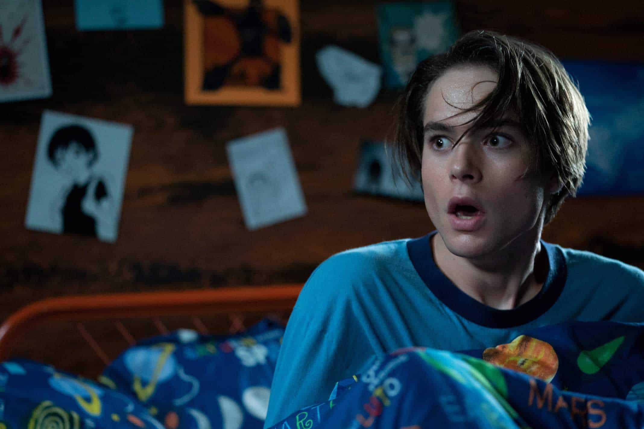 JUDAH LEWIS as COLE looking shocked by something.