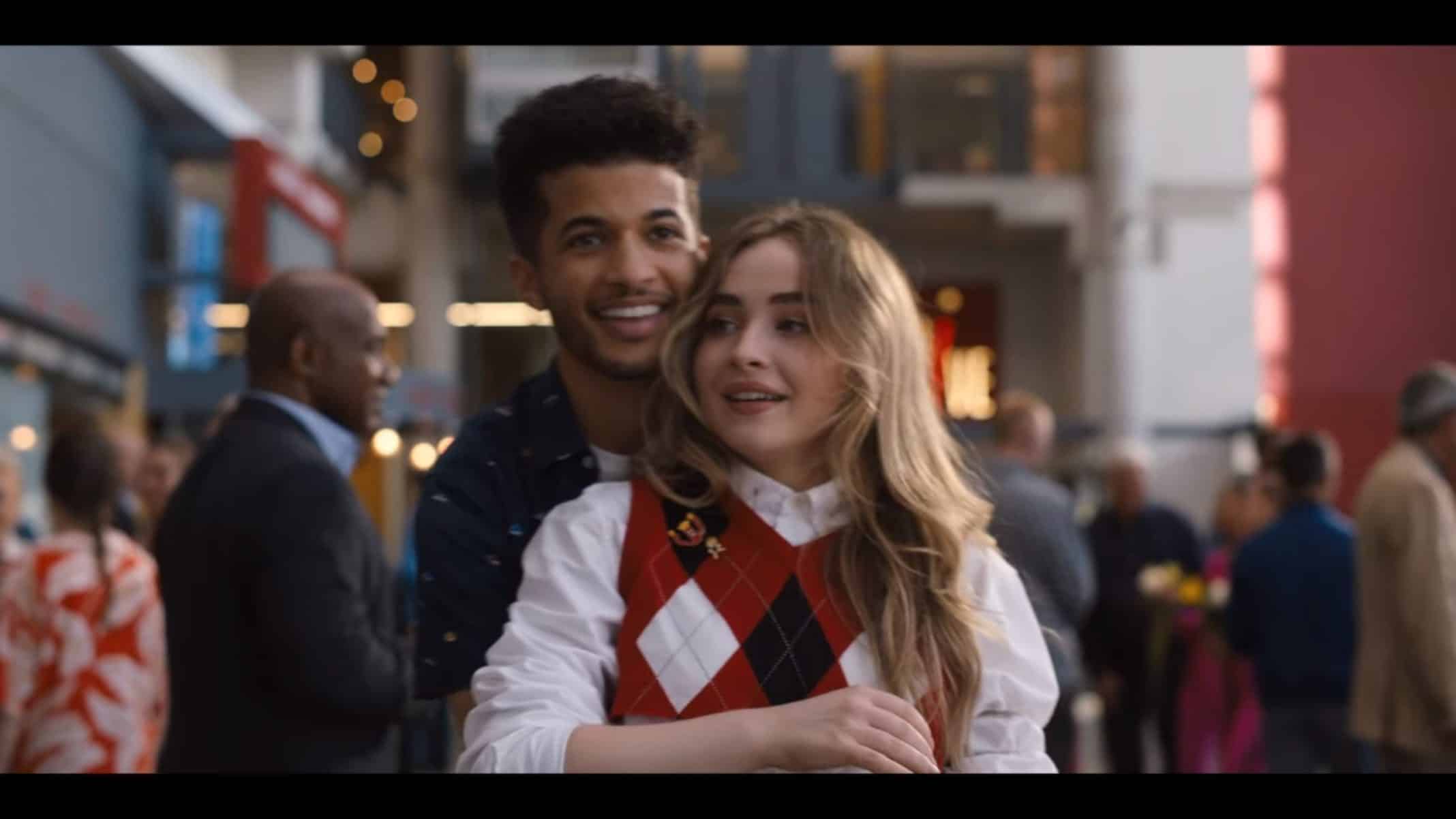 Jake (Jordan Fisher) and Quinn (Sabrina Carpenter) holding one another.