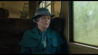 Mrs. Medlock (Julie Walters) on a train.