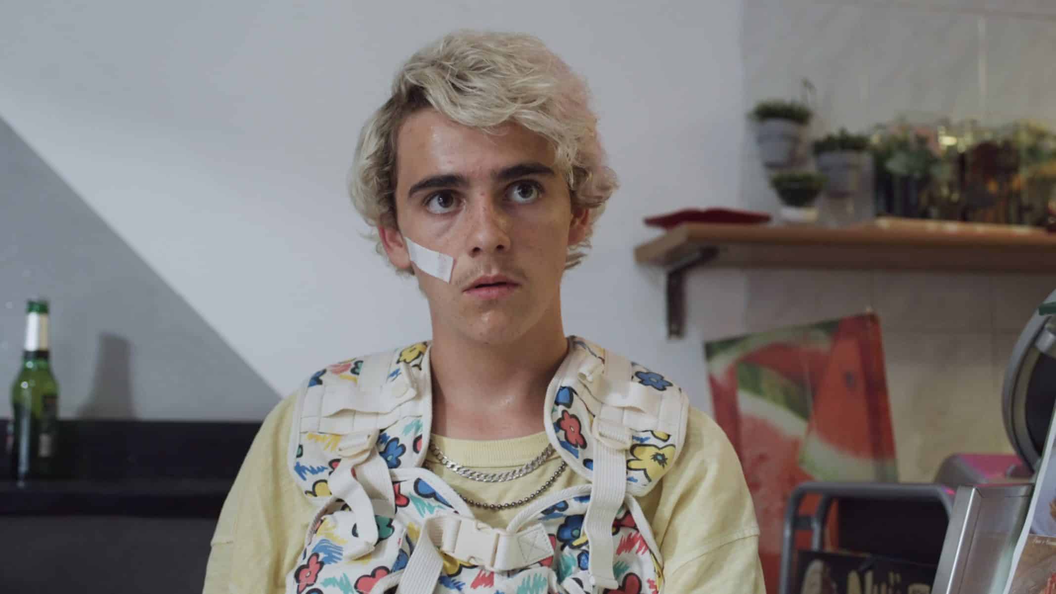 Fraser (Jack Dylan Grazer) in a colorful vest.