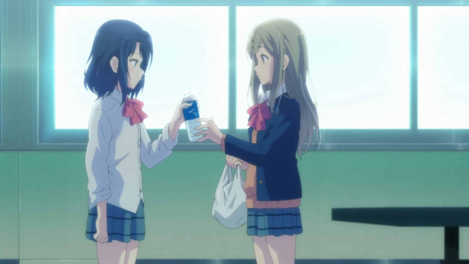 Shimamura giving Adachi some water.