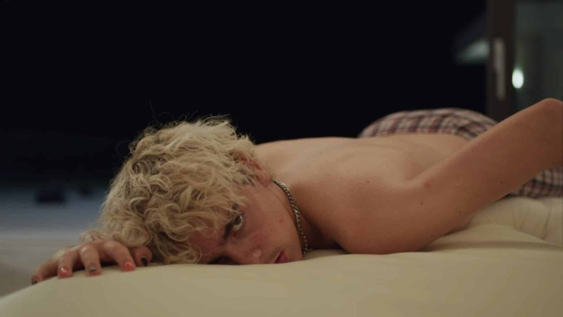 Fraser laying down, drunk.