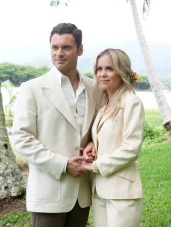 Jorge (Adan Canto) and Leslie (Radha Mitchell) on their wedding day.