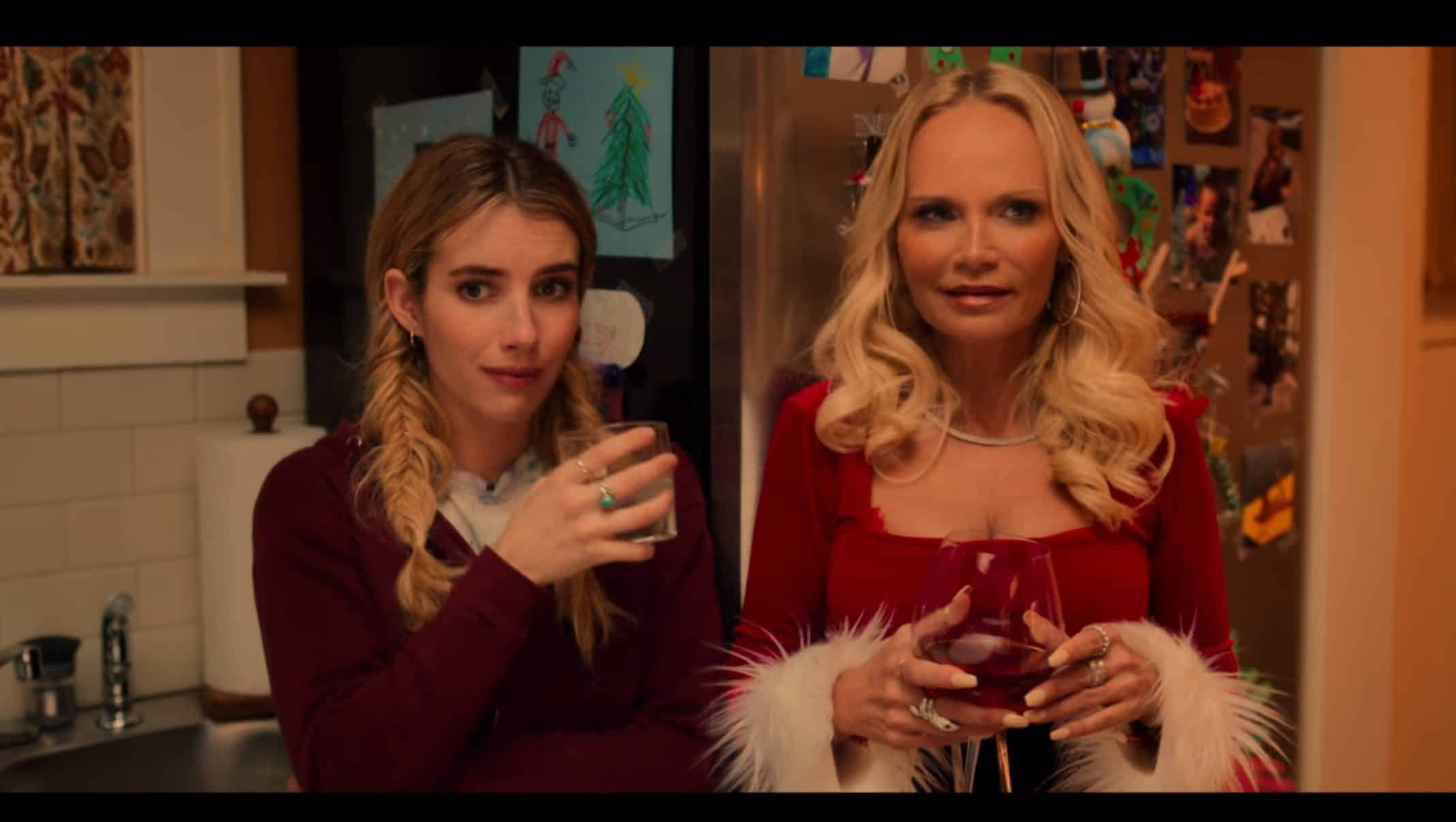 Sloane (Emma Roberts) and Aunt Susan (Kristin Chenoweth) at their family's Christmas dinner