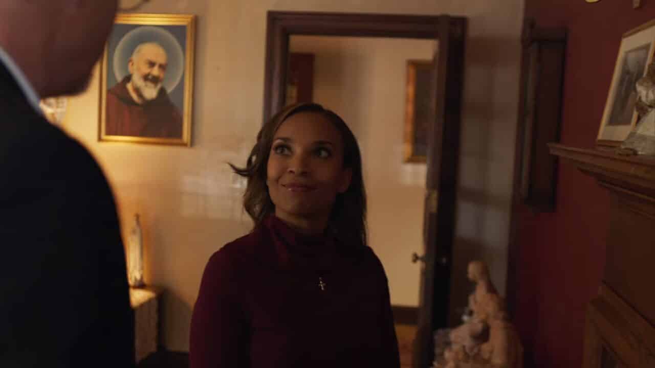 Jennifer 2019 (Nia Fairweather) talking to her church's Father