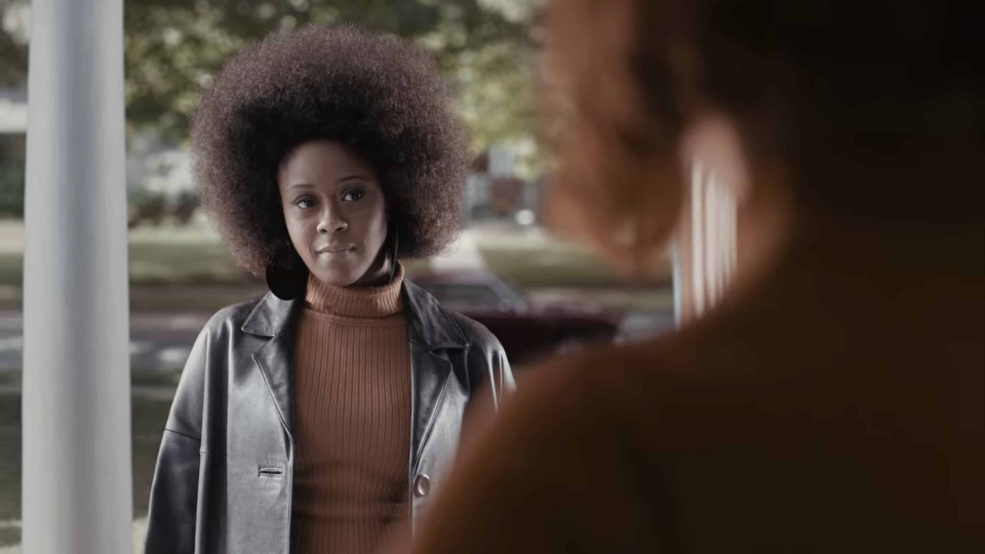 Jolene, with a giant fro, showing up at Beth's door.