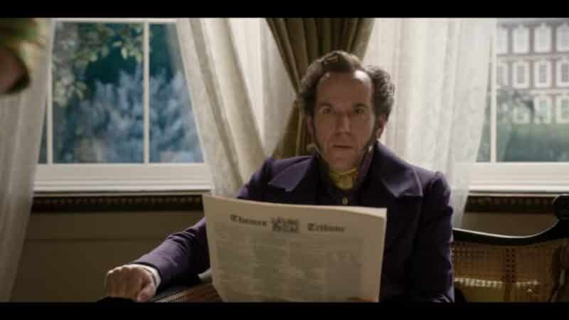 Archibald Featherington (Ben Miller) reading the paper