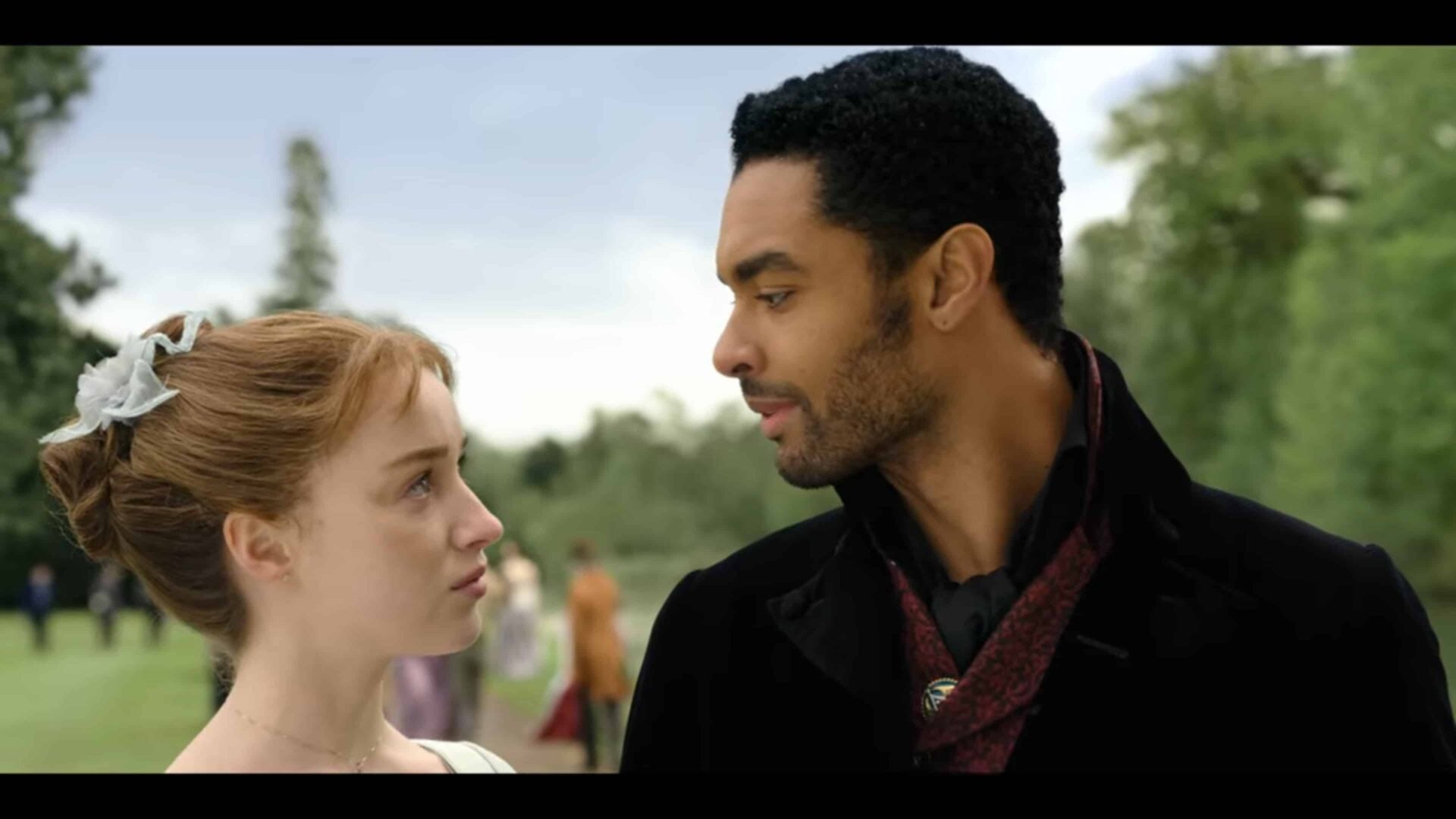 Daphne and Simon looking at one another