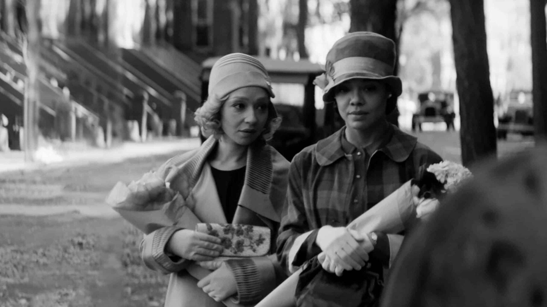 Clare (Ruth Negga) and Irene (Tessa Thompson) walking together on the street