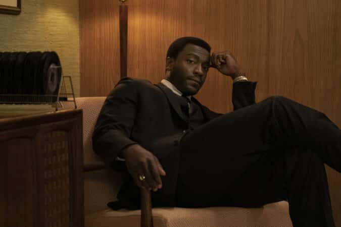 Jim Brown (Aldis Hodge) sitting in a chair