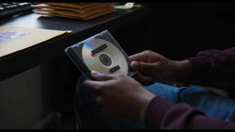 Jordin holding the documentary he made, and preparing to send it out.