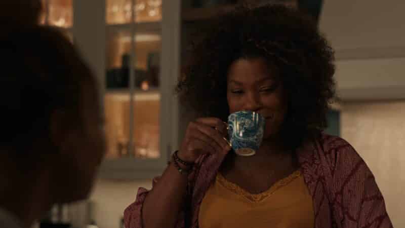 Aunt Vi (Lorraine Toussaint) sipping tea