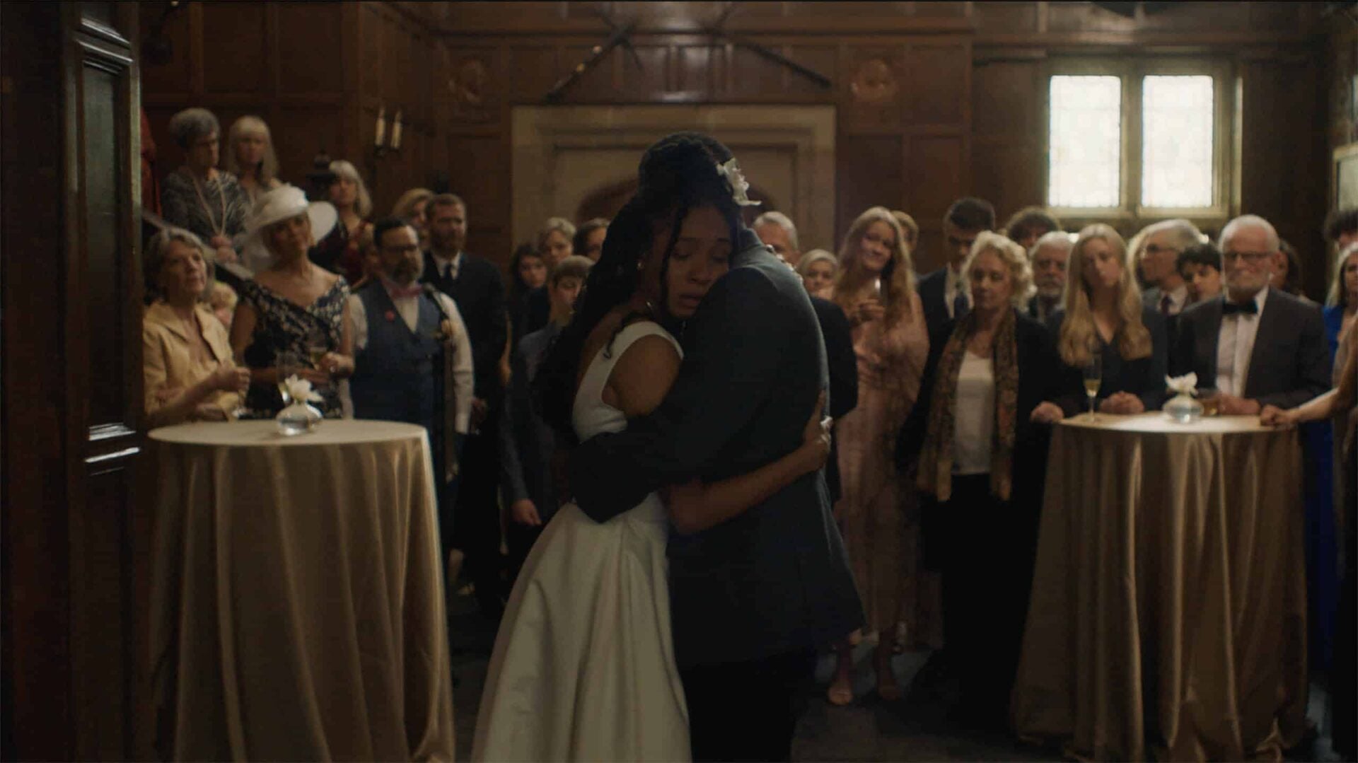 Bella (Nabiyah Be) and Bower (Curtiss Cook) hugging at Bella's wedding