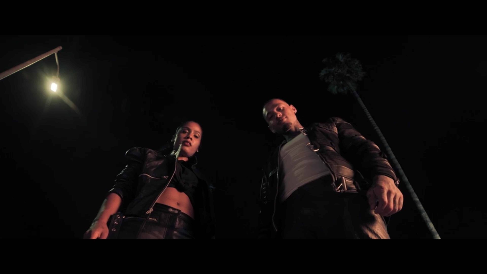 Erica and Eric standing over Imani