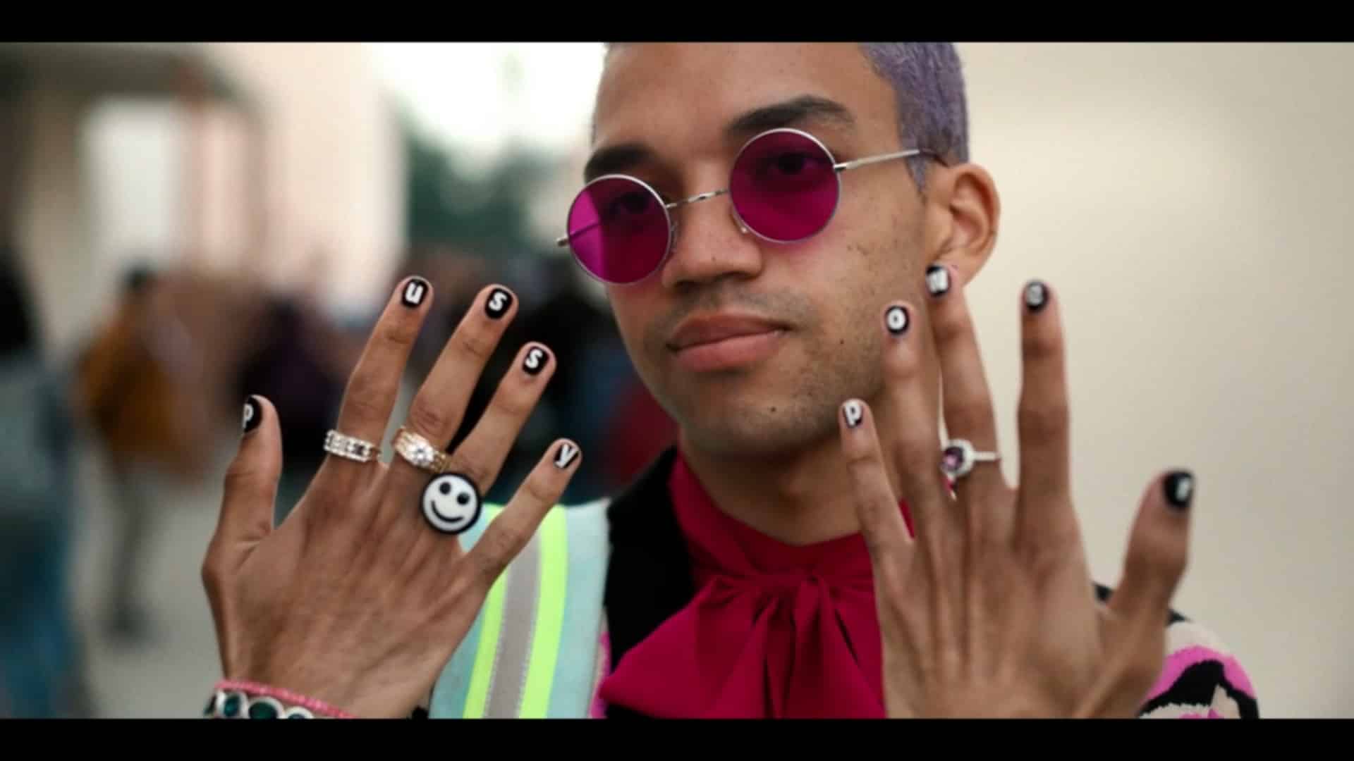 Chester, with his nails painted to say "Pussy Power"