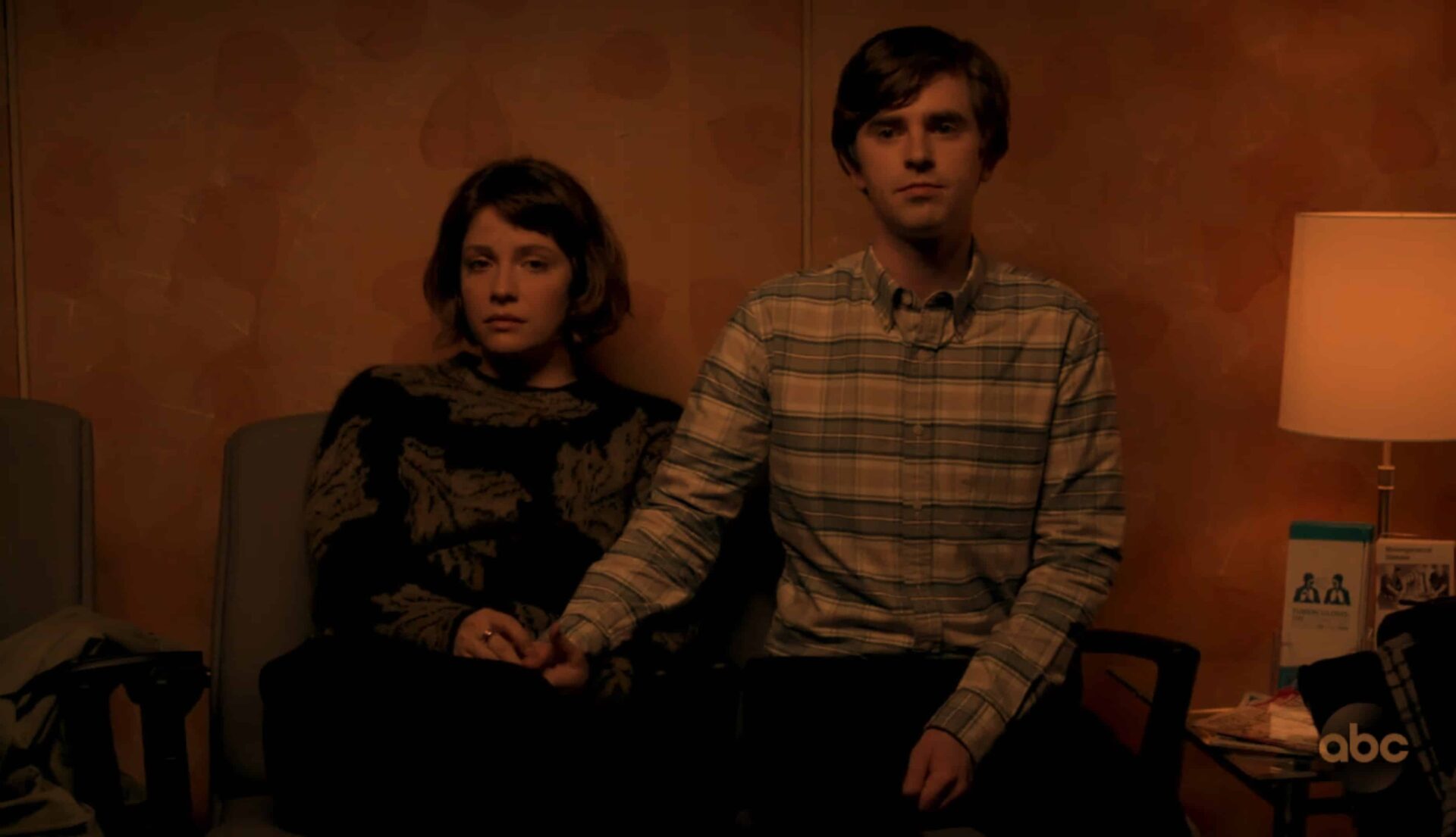 Lea and Shaun sitting in an abortion clinic together.