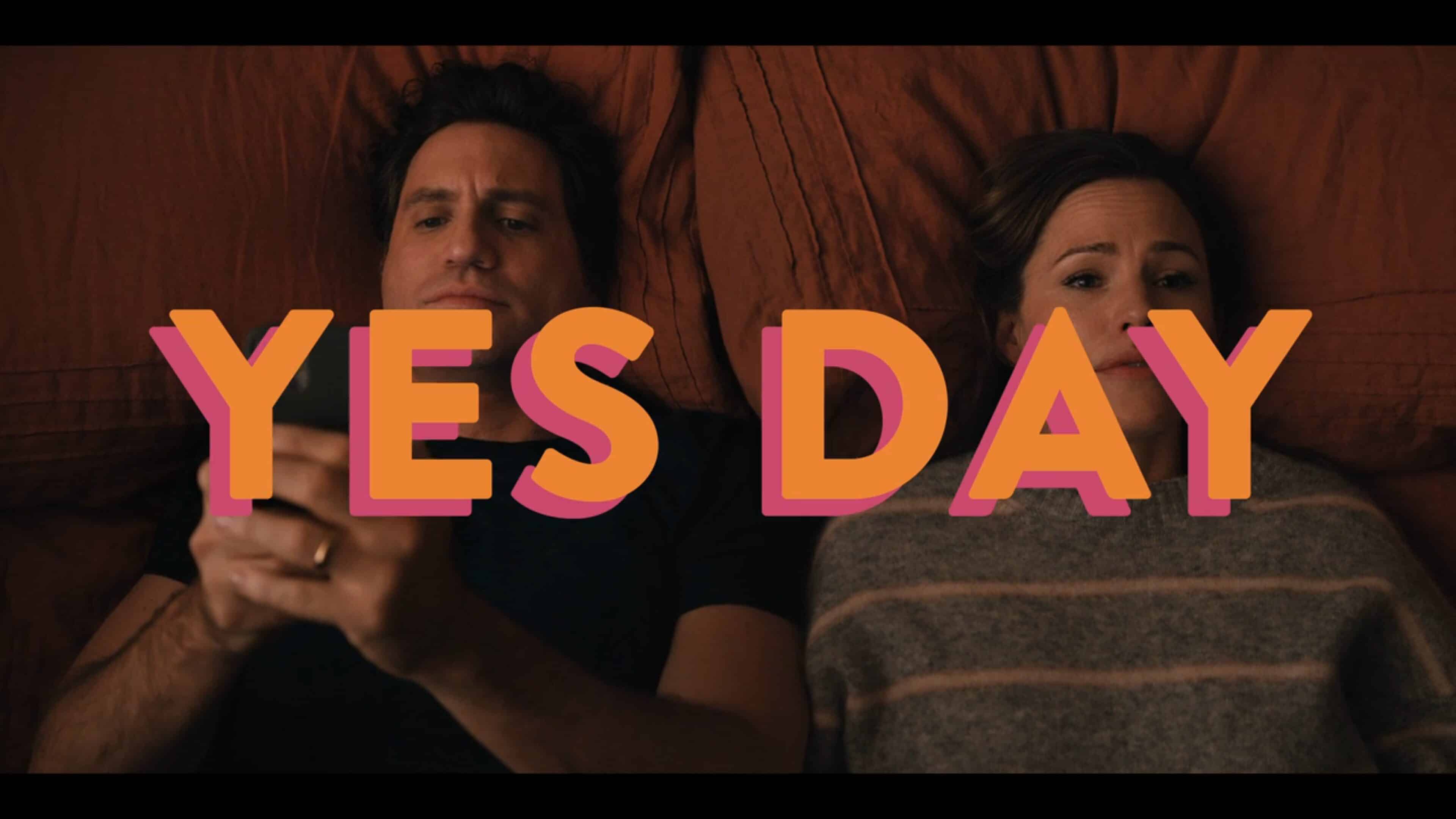 Carlos (Edgar Ramirez) and Allison (Jennifer Garner) on the bed, with Carlos on his phone