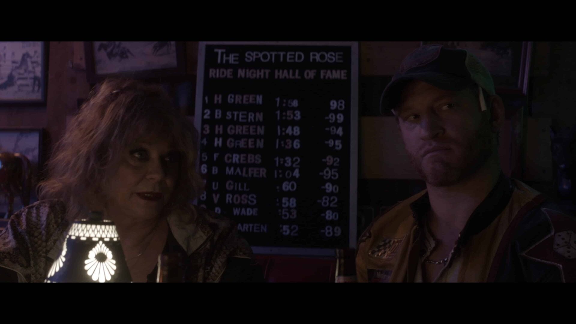 Ma Voss (Jeanette O'Connor) and Danny (Brent Chase) making a deal with Herb