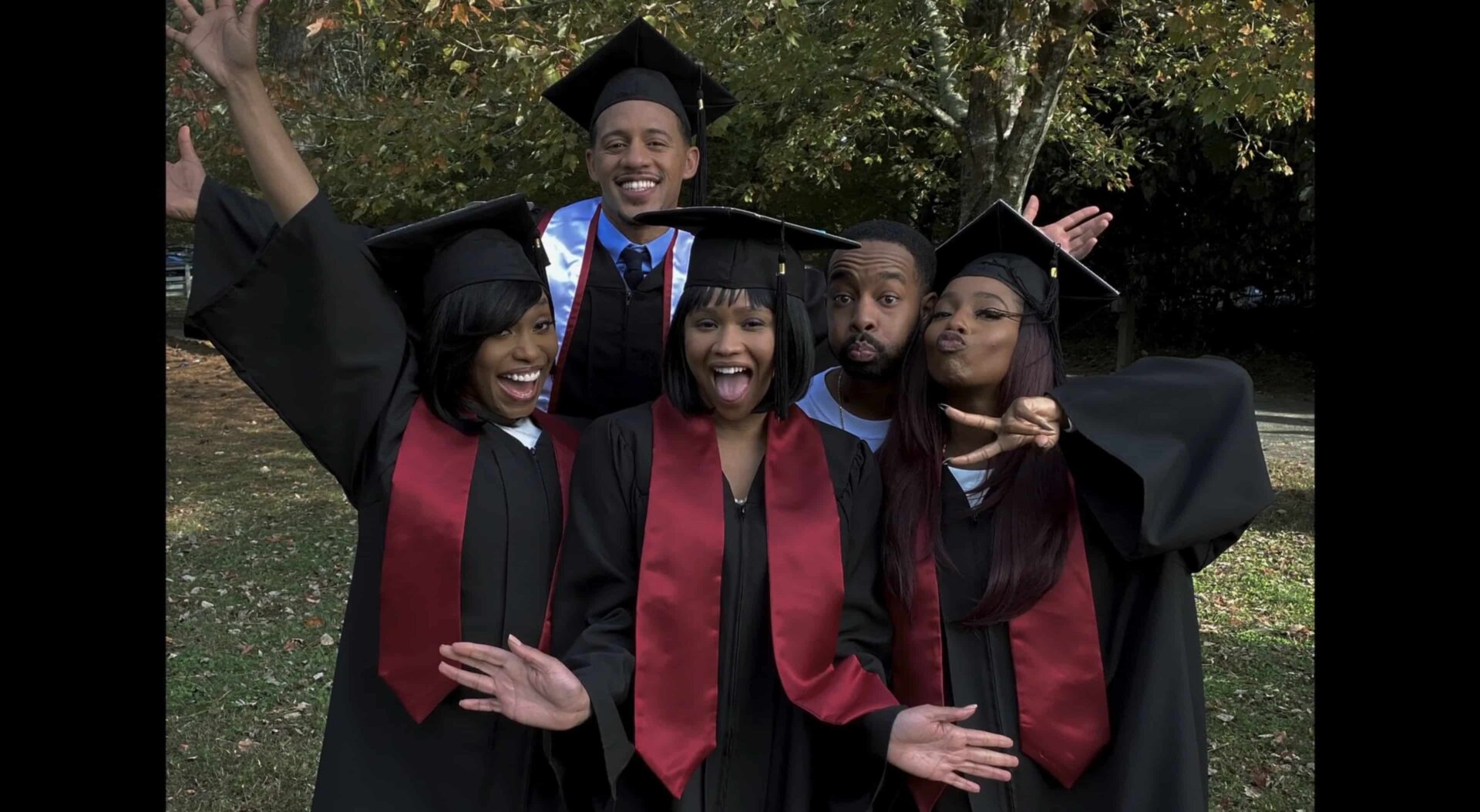 Veronica, Deon, Layne, and Tracey in their caps and gowns - with Vince also in the picture