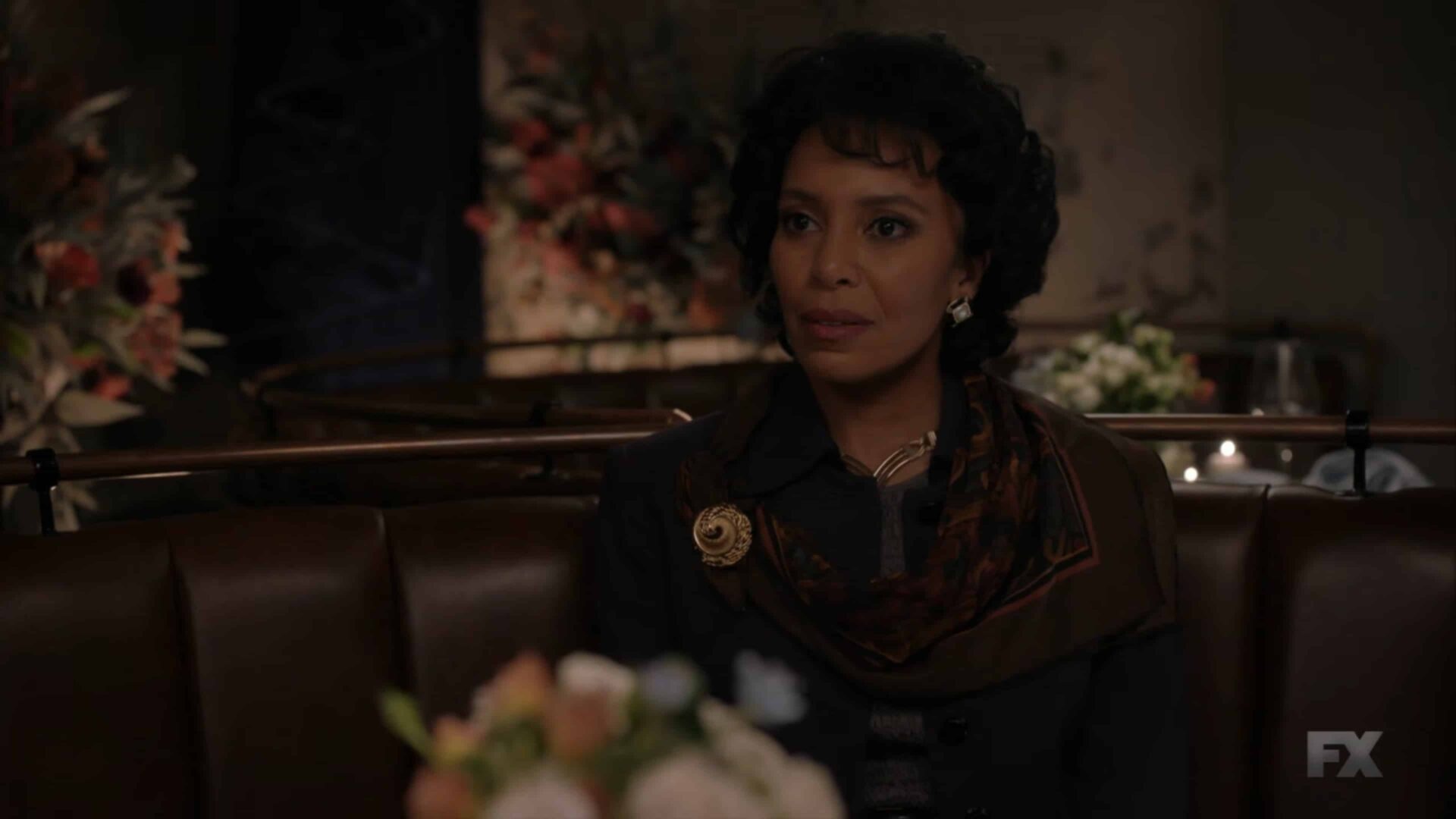 Angie (Eisa Davis) having dinner with Christopher and Blanca