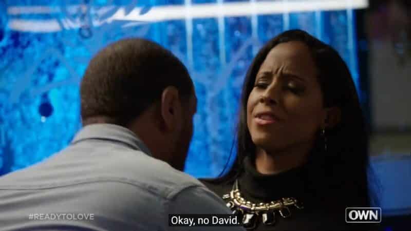 David trying to kiss Liz and her dodging that