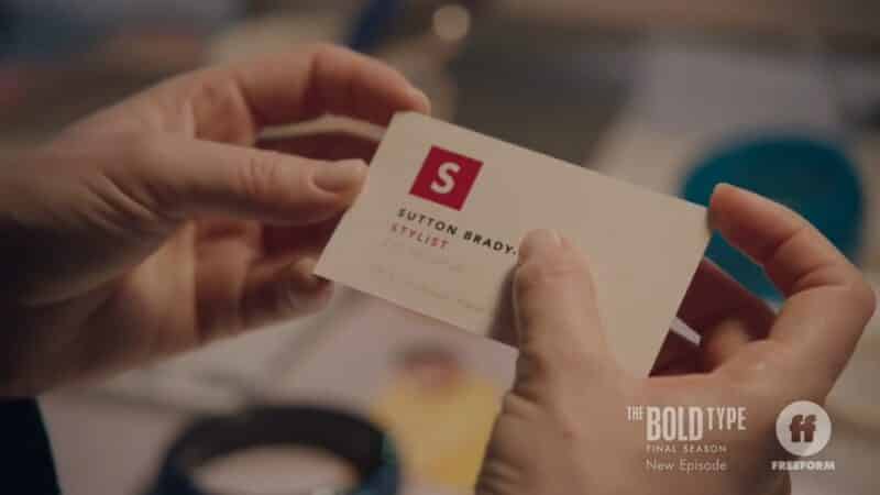 Sutton looking at her new business cards which had Richard's last name added after her own