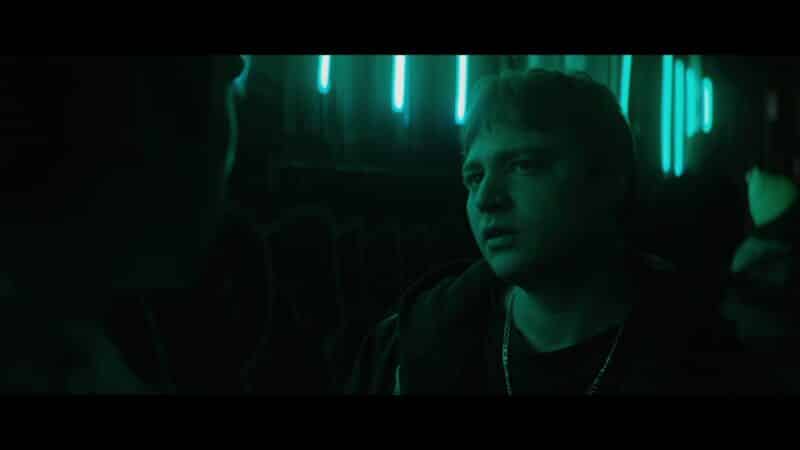 Sebastian (Emory Cohen)  talking to Fred