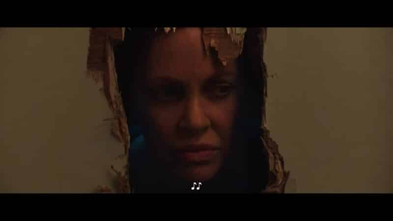 Ms. Burton (Kristin Bauer van Straten) breaking through her bathroom door, with an axe, to get to Bobby