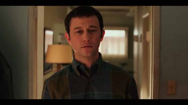 Josh (Joseph Gordon-Levitt) looking at his musical instruments