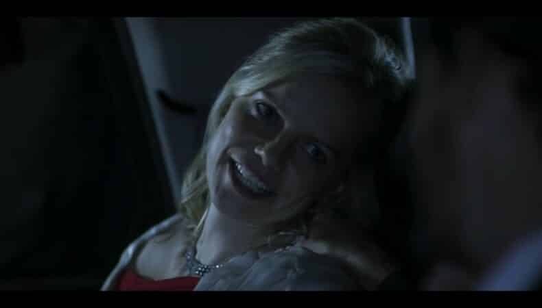 Olivia (Mircea Monroe) in Rose's car, joking with her husband