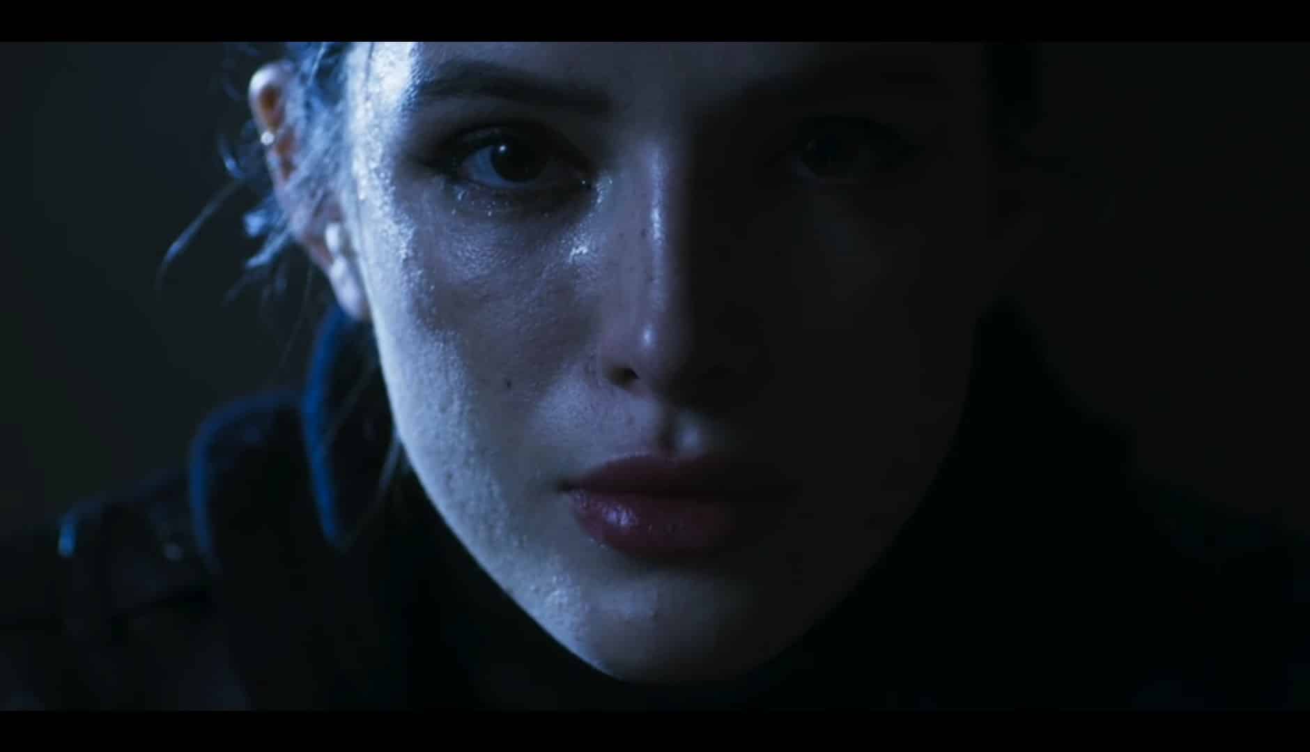 Rose (Bella Thorne) starring at the face of the man who killed her parents