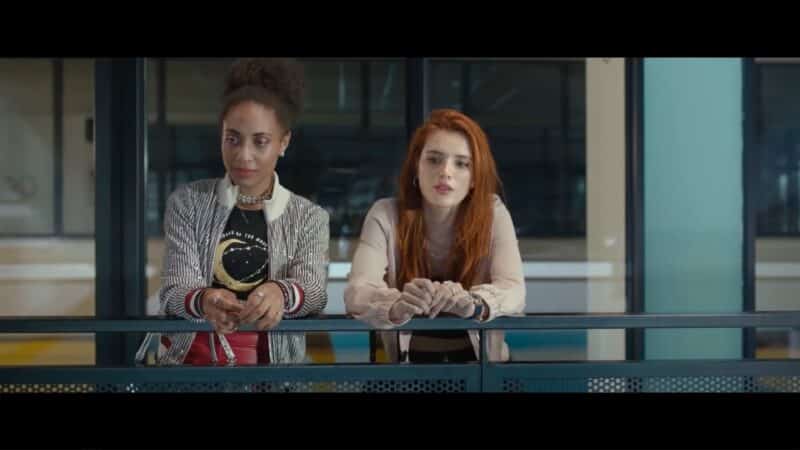 Christine (Bonnie Baddoo) and Vivien (Bella Thorne) watching Steve and Roy swim