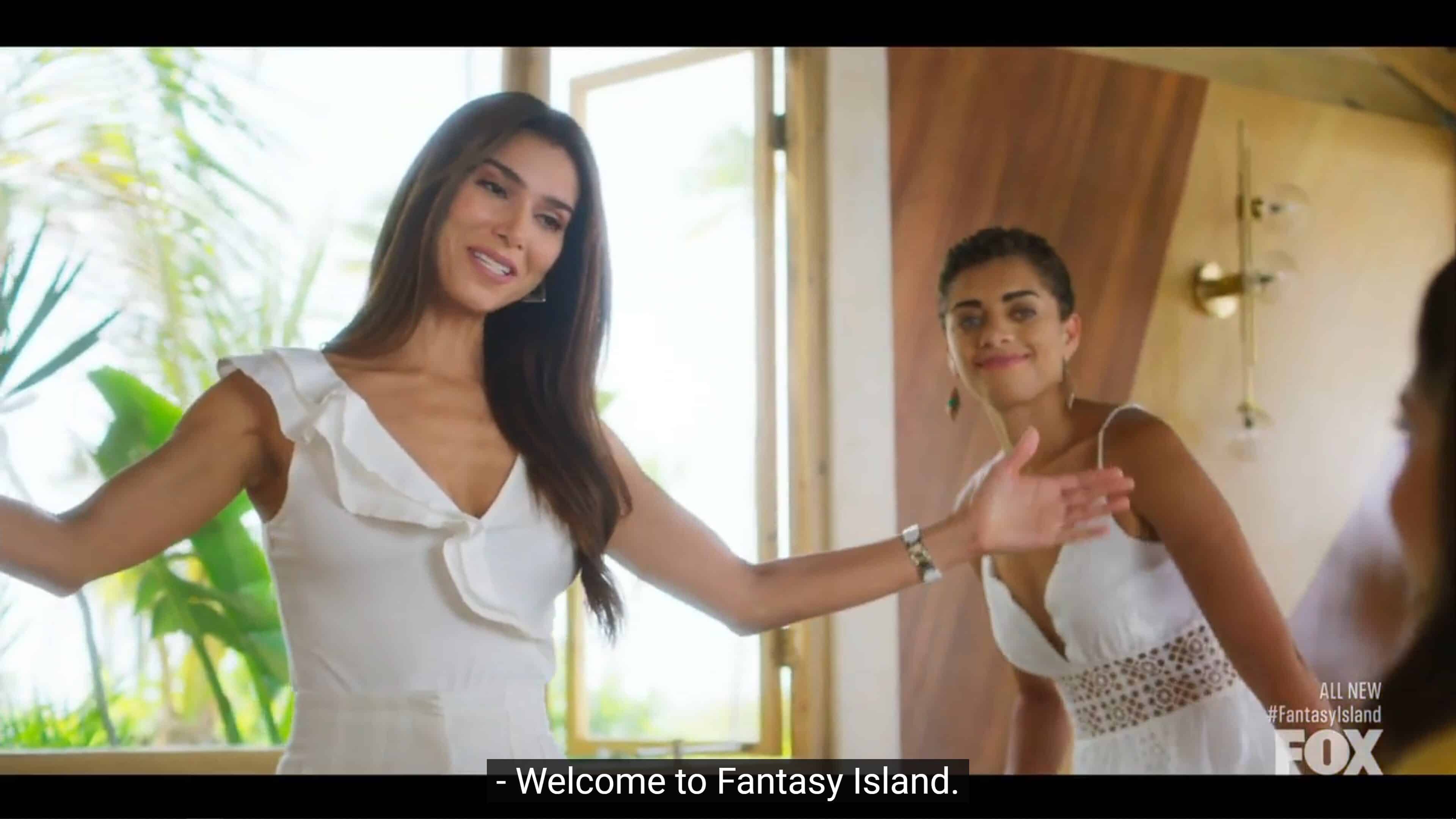 Elena welcomign someone to Fantasy Island