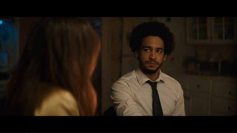 Benny (Jorge Lendeborg Jr.) in his grandmother's kitchen with Blaire