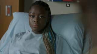 Madeline (Blessing Adedijo) in a hospital bed