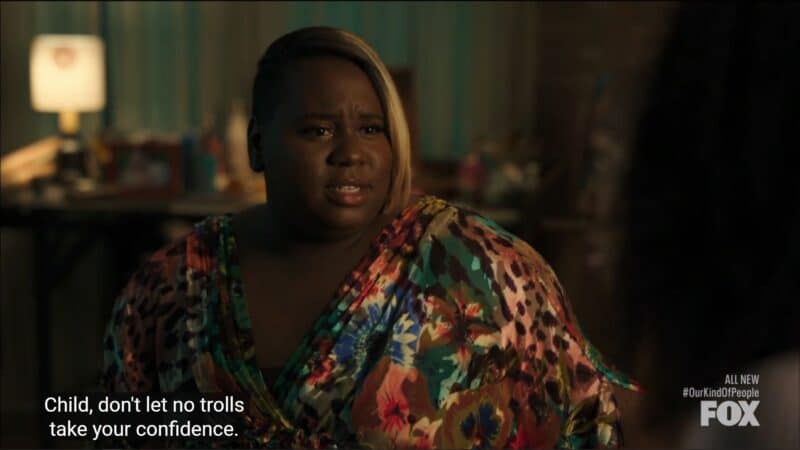 Uncle Tizzie (Alex Newell) talking to Nikki