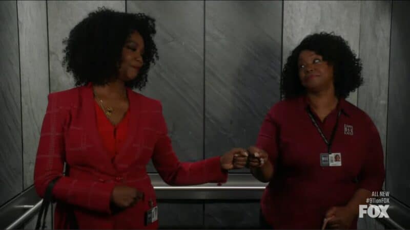 Claudette and Linda (Chiquita Fuller) fist bumping