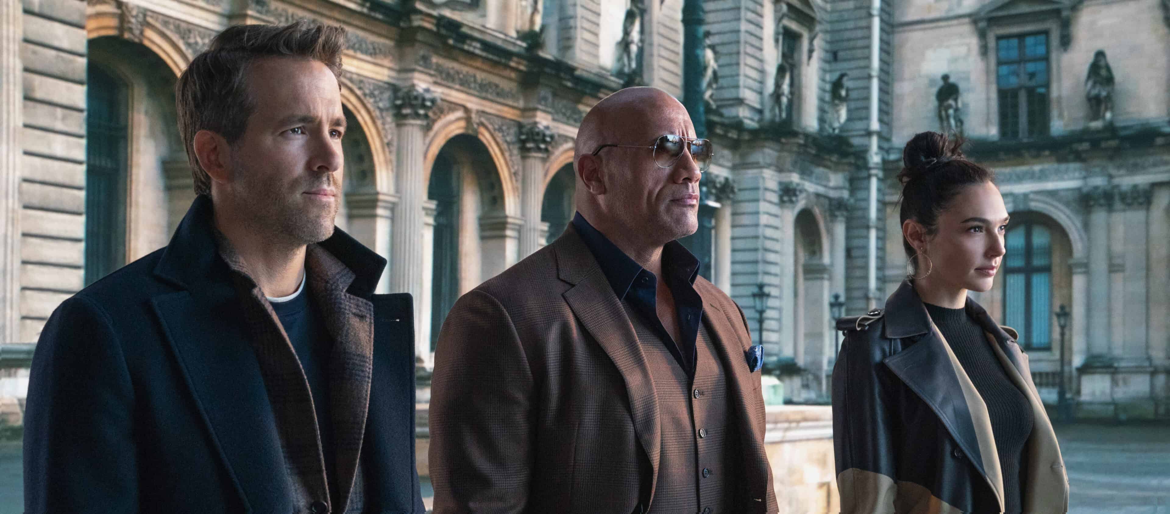Nolan Booth (Ryan Reynolds), Agent John Hartly (Dwayne Johnson), and The Bishop (Gal Gadot) when they team up